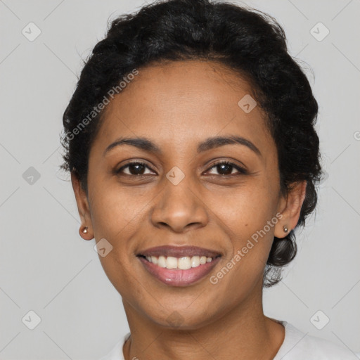 Joyful latino young-adult female with short  black hair and brown eyes