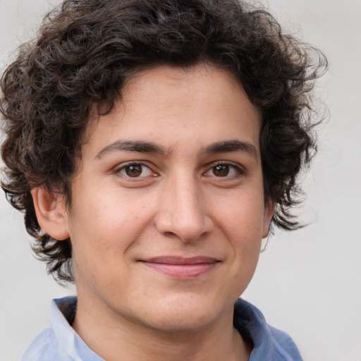 Joyful white young-adult male with medium  brown hair and brown eyes