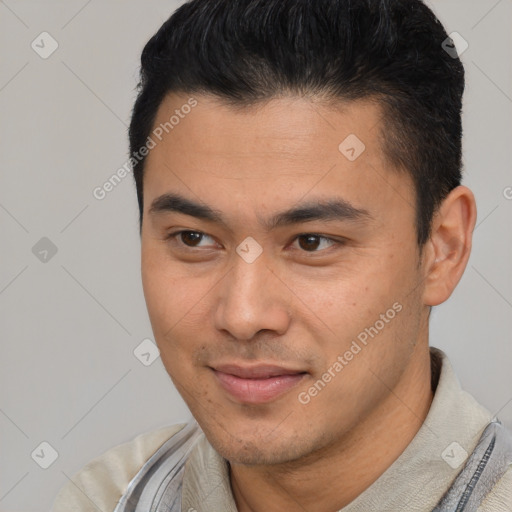 Joyful latino young-adult male with short  brown hair and brown eyes