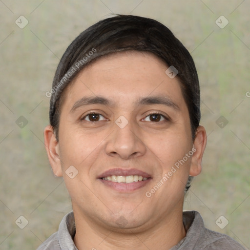 Joyful white adult male with short  black hair and brown eyes