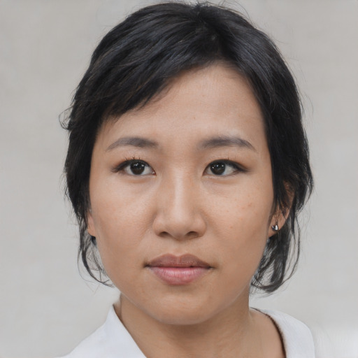 Neutral asian young-adult female with medium  black hair and brown eyes