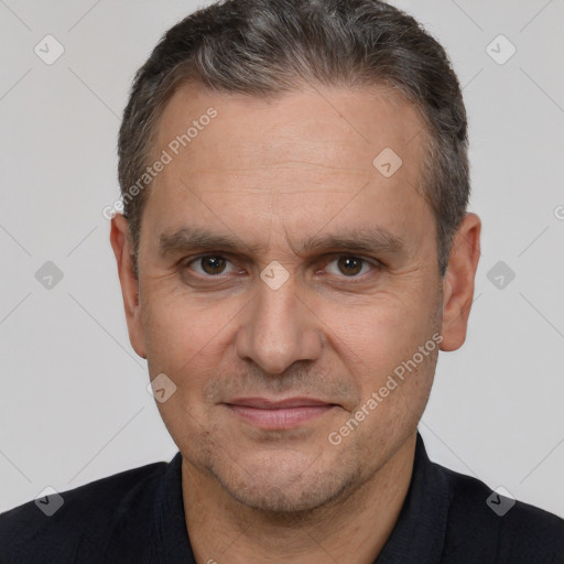 Joyful white adult male with short  brown hair and brown eyes