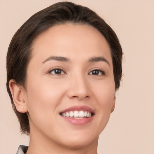 Joyful white young-adult female with medium  brown hair and brown eyes