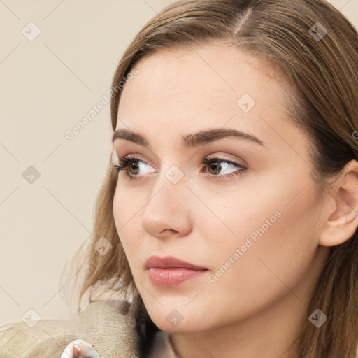 Neutral white young-adult female with long  brown hair and brown eyes