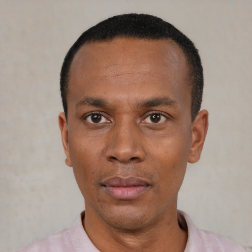 Neutral black young-adult male with short  black hair and brown eyes