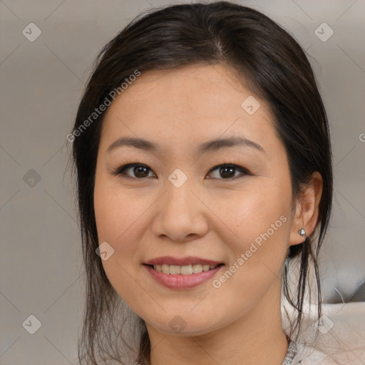 Joyful asian young-adult female with medium  brown hair and brown eyes