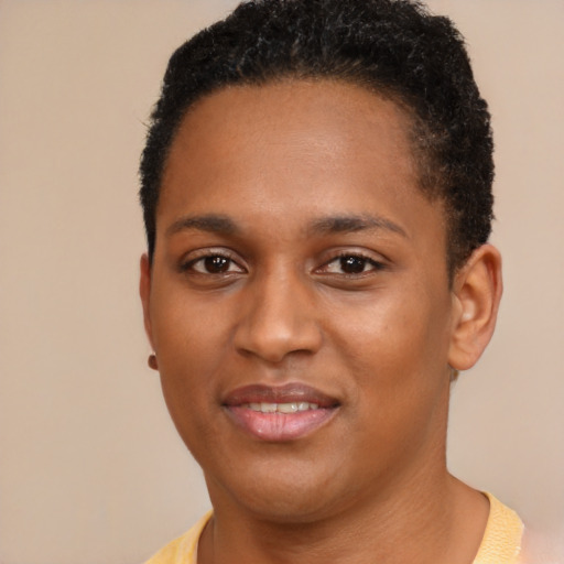 Joyful black young-adult female with short  brown hair and brown eyes