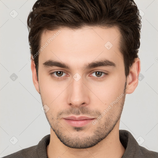 Neutral white young-adult male with short  brown hair and brown eyes