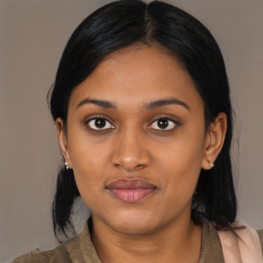Joyful latino young-adult female with medium  black hair and brown eyes