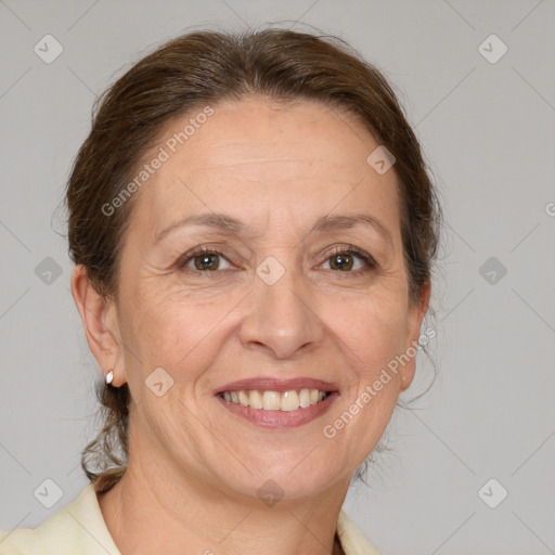 Joyful white adult female with medium  brown hair and brown eyes