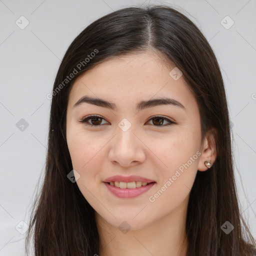 Joyful asian young-adult female with long  brown hair and brown eyes