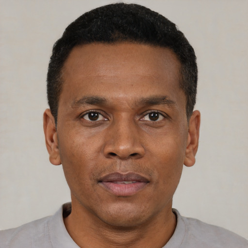 Neutral black young-adult male with short  black hair and brown eyes