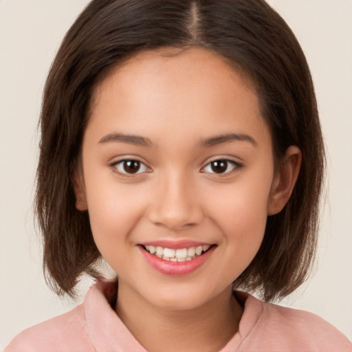 Joyful white child female with medium  brown hair and brown eyes