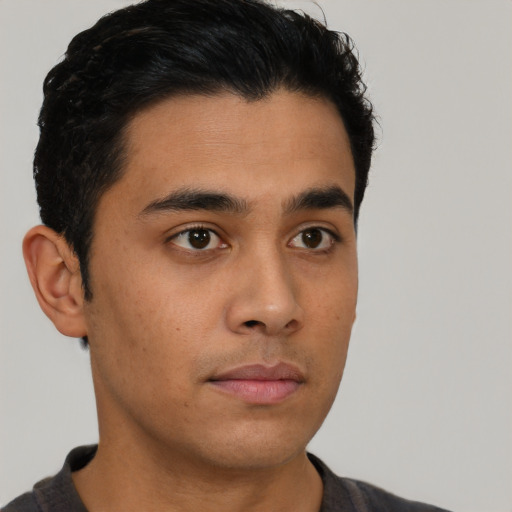 Neutral latino young-adult male with short  brown hair and brown eyes