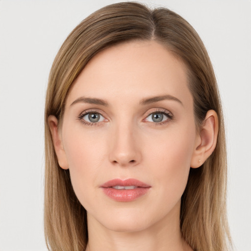 Joyful white young-adult female with long  brown hair and grey eyes