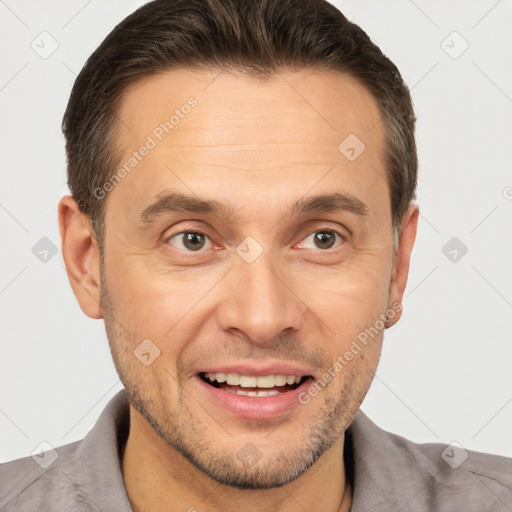 Joyful white adult male with short  brown hair and brown eyes