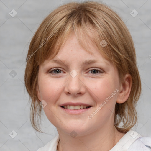 Joyful white young-adult female with medium  brown hair and blue eyes