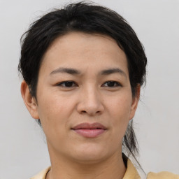 Joyful asian young-adult female with short  brown hair and brown eyes