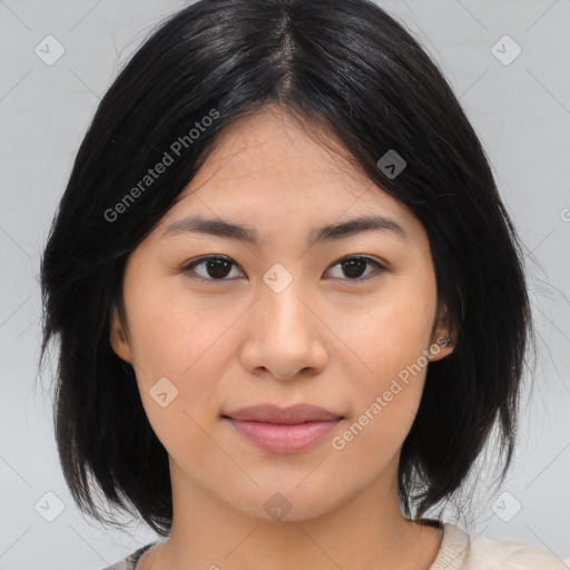 Joyful asian young-adult female with medium  black hair and brown eyes