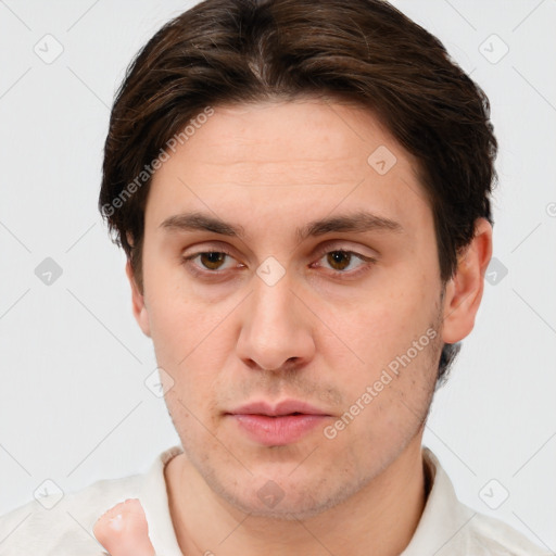 Neutral white young-adult male with short  brown hair and brown eyes