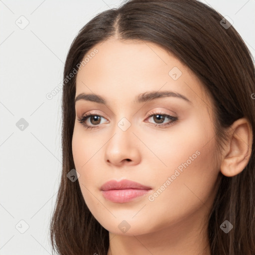 Neutral white young-adult female with long  brown hair and brown eyes