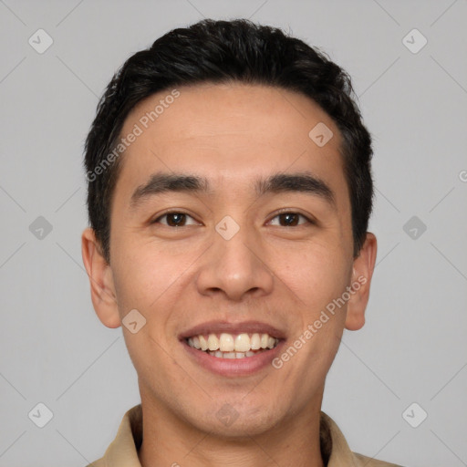 Joyful white young-adult male with short  black hair and brown eyes