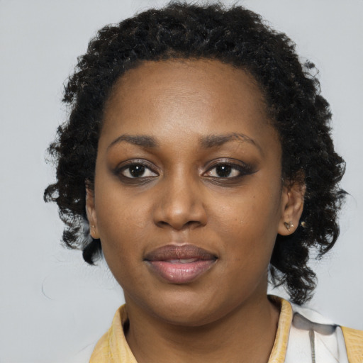 Neutral black young-adult female with long  brown hair and brown eyes