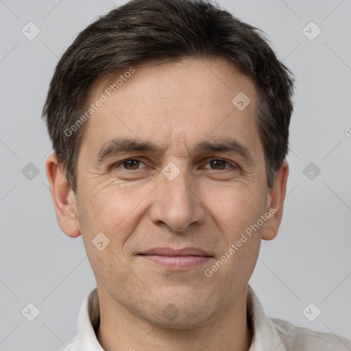 Joyful white adult male with short  brown hair and brown eyes