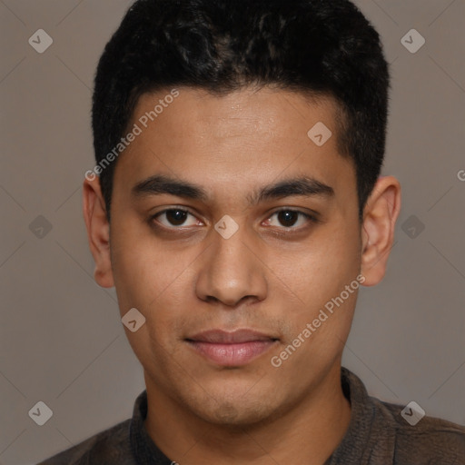 Joyful latino young-adult male with short  brown hair and brown eyes