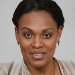 Joyful black young-adult female with short  brown hair and brown eyes