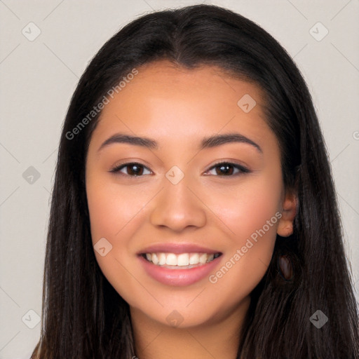 Joyful latino young-adult female with long  brown hair and brown eyes