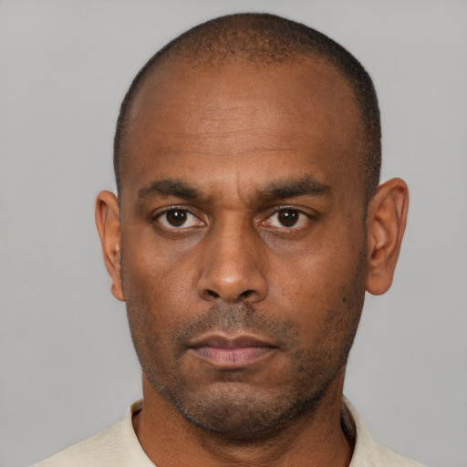 Neutral latino adult male with short  brown hair and brown eyes
