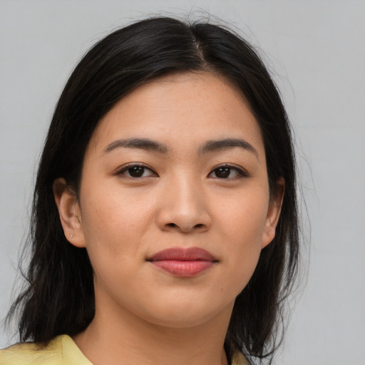 Joyful asian young-adult female with medium  brown hair and brown eyes
