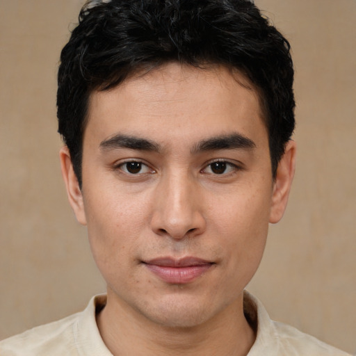 Joyful asian young-adult male with short  brown hair and brown eyes