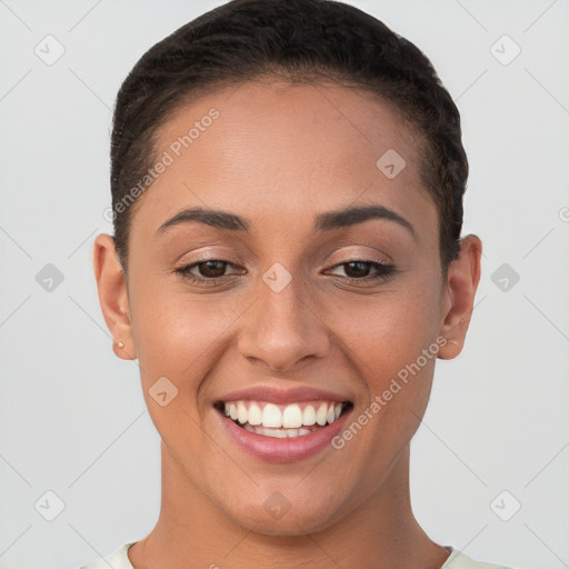 Joyful white young-adult female with short  brown hair and brown eyes