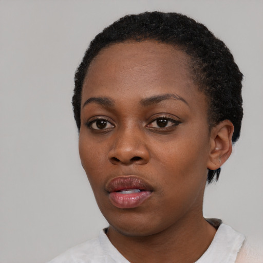 Neutral black young-adult female with short  black hair and brown eyes