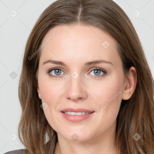 Joyful white young-adult female with long  brown hair and blue eyes