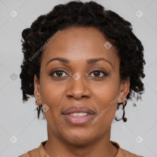 Joyful black adult female with short  brown hair and brown eyes