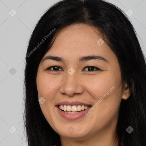 Joyful asian young-adult female with long  brown hair and brown eyes