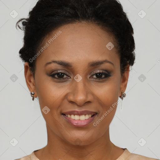 Joyful black young-adult female with short  brown hair and brown eyes