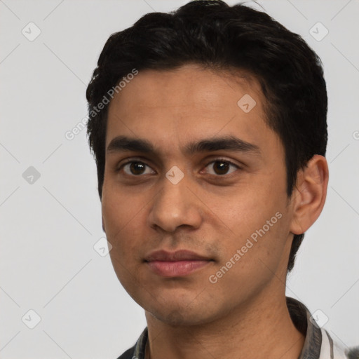 Neutral latino young-adult male with short  black hair and brown eyes