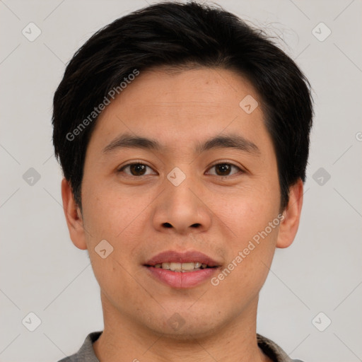 Joyful asian young-adult male with short  brown hair and brown eyes