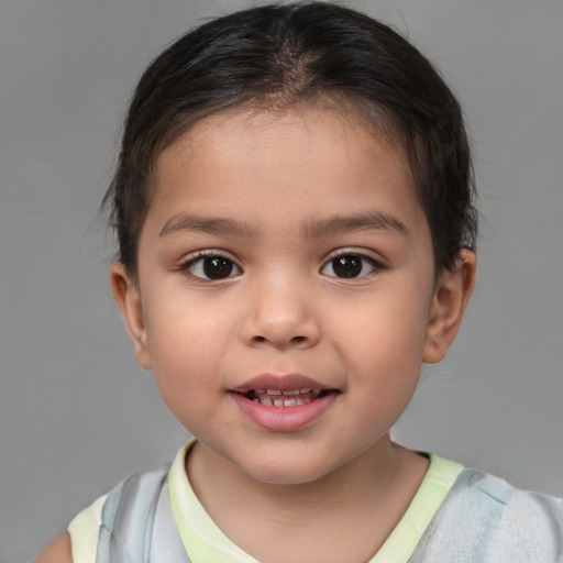 Joyful white child female with short  brown hair and brown eyes