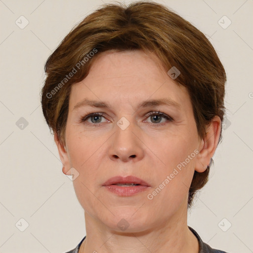 Joyful white adult female with short  brown hair and brown eyes