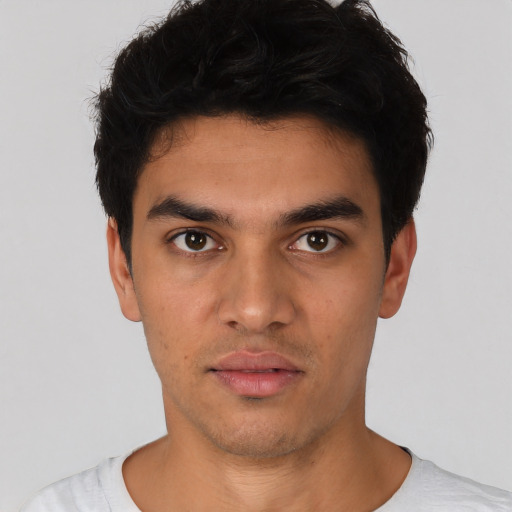 Neutral white young-adult male with short  black hair and brown eyes