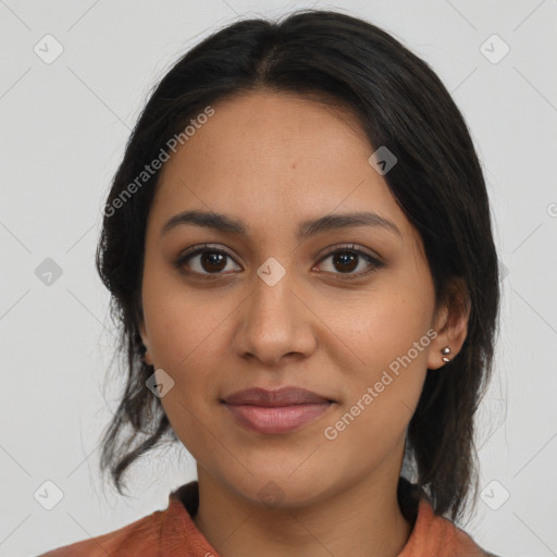 Joyful latino young-adult female with medium  brown hair and brown eyes