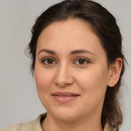 Joyful white adult female with medium  brown hair and brown eyes