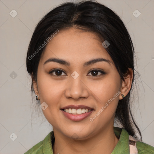 Joyful latino young-adult female with medium  brown hair and brown eyes