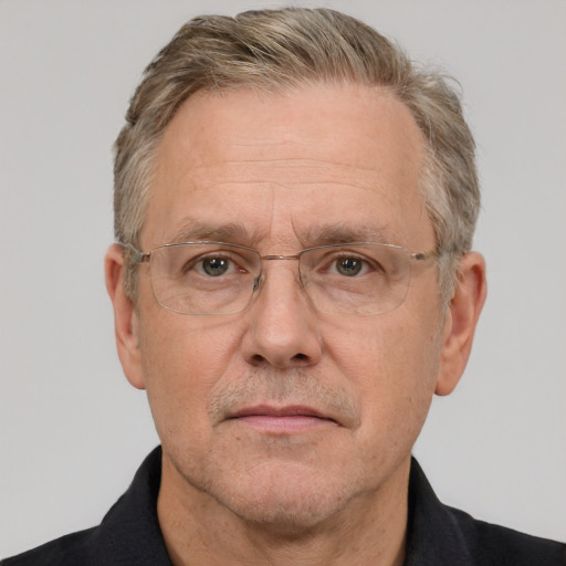 Neutral white middle-aged male with short  gray hair and brown eyes