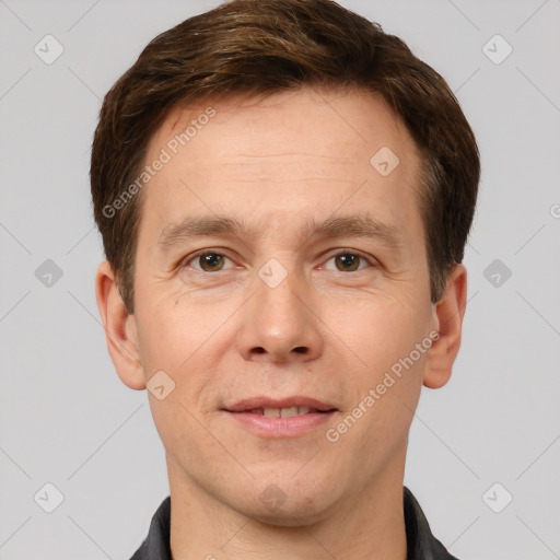 Joyful white adult male with short  brown hair and brown eyes